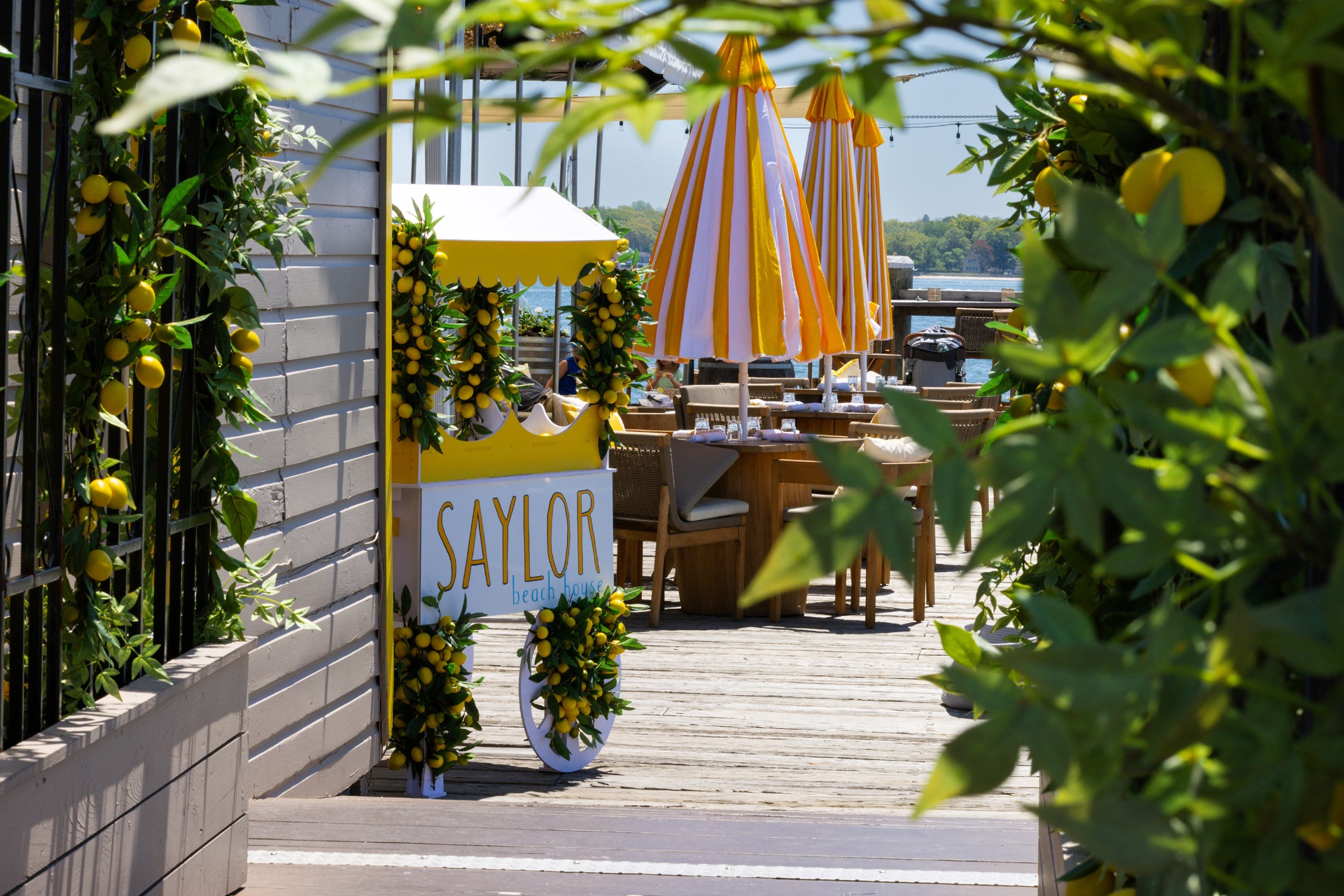 Lemon-adorned Saylor Beach House signage on the dock