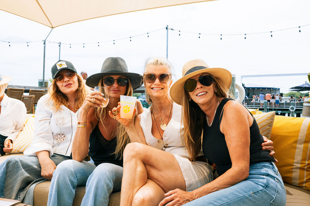 Friends gathered on the deck with cocktails