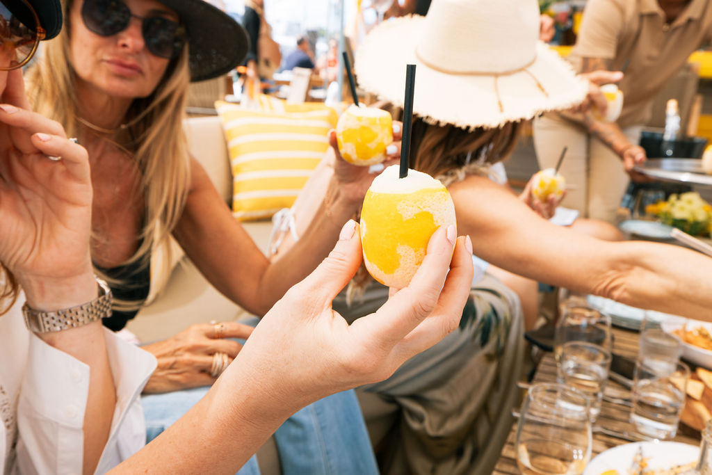 Signature frozen lemon cocktails in hand