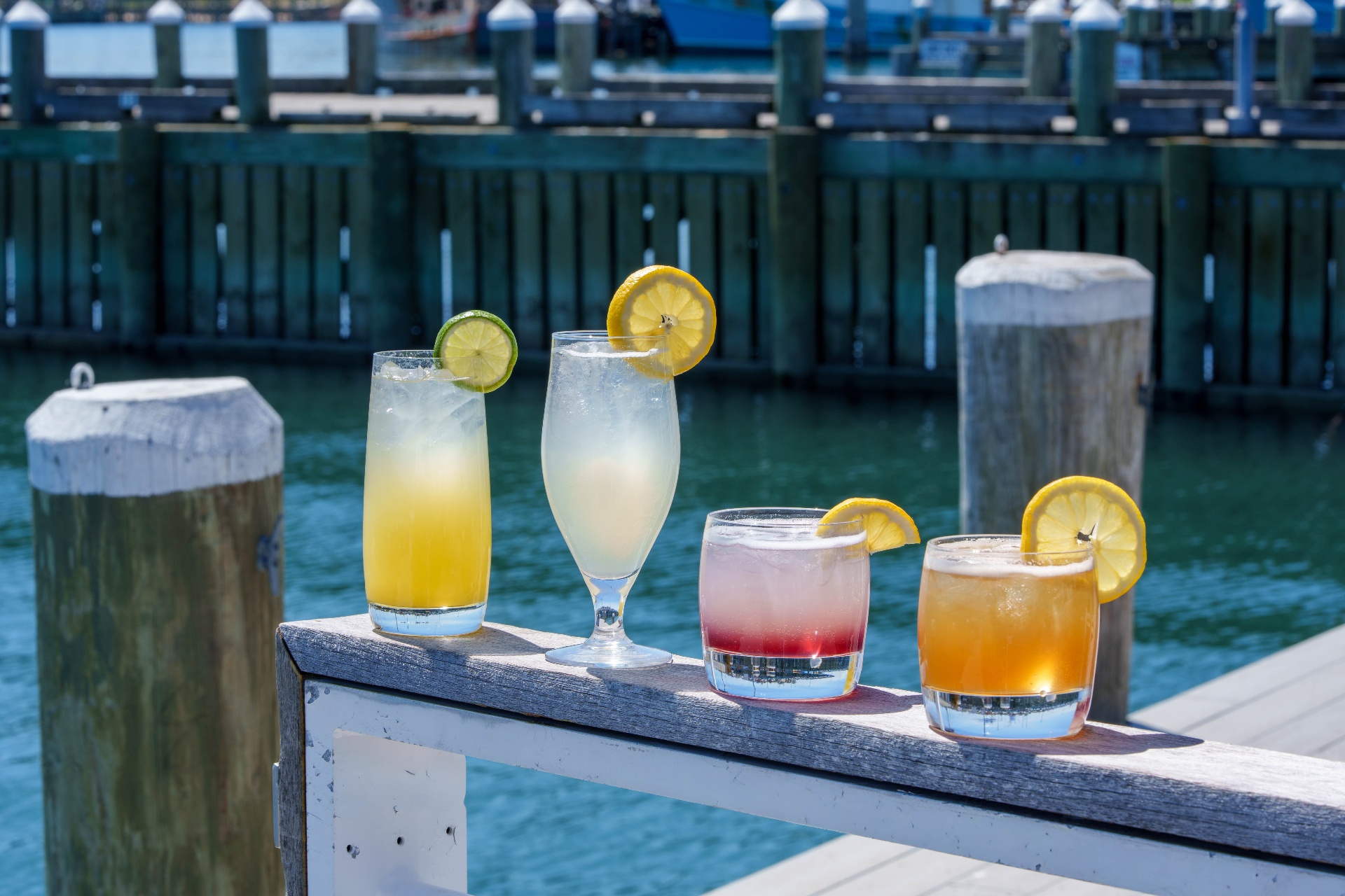 Lineup of signature drinks along the marina railing